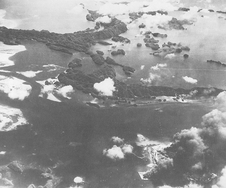 attack on palau-18.JPG - The tanker Iro (top right)  is trailing black smoke from its aftship, whilst the Nagisan Maru (centre) has been hit and white smoke is coming from its midship section.